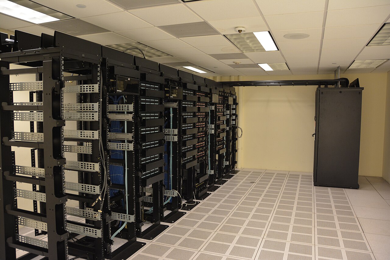 Data-centre server racks in a November 2015 file photograph by Carl Lender; not the proposed Point Tupper campus or Anthropic equipment.